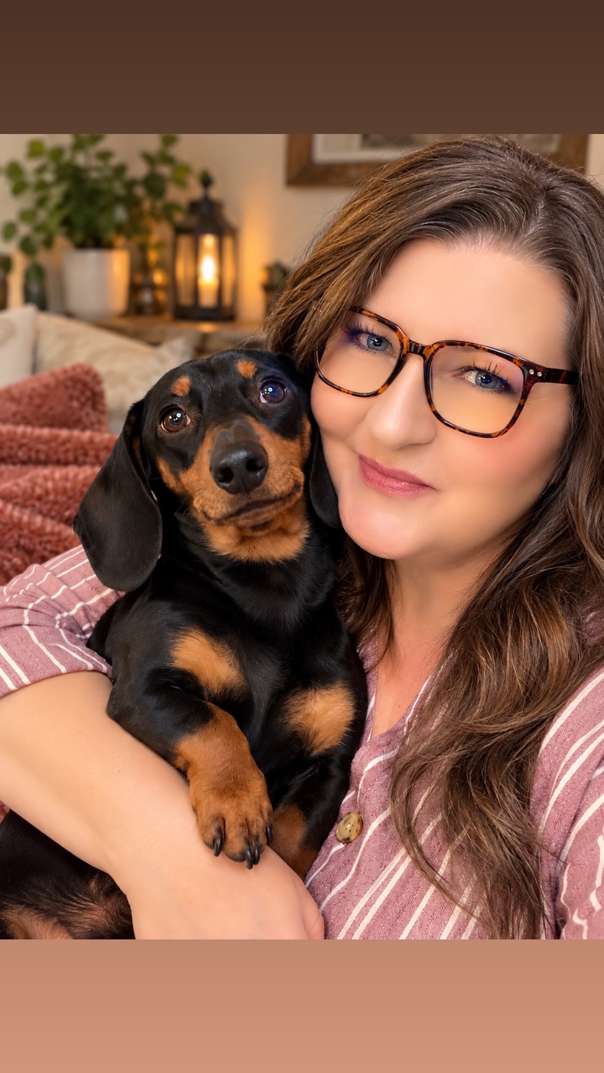 Children’s book author Tessa Peterson holding Winston the dachshund